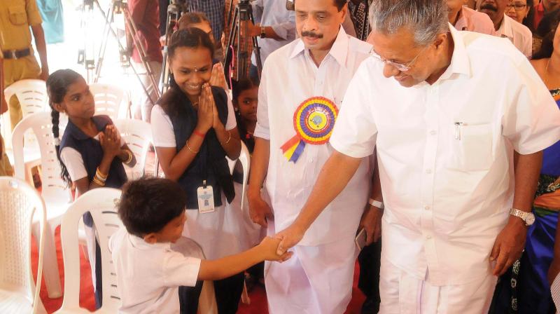 Chief Minister Pinarayi Vijayan shakes hands with a  child before inaugurating the Platinum jubilee of Government VHSS for the Deaf at Jagathy in Thiruvananthapuram on Wednesday. (Photo:DC)