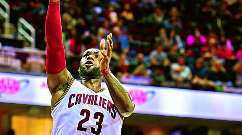 LeBron James of the Cleveland Cavaliers goes up for a basket in this file photo.