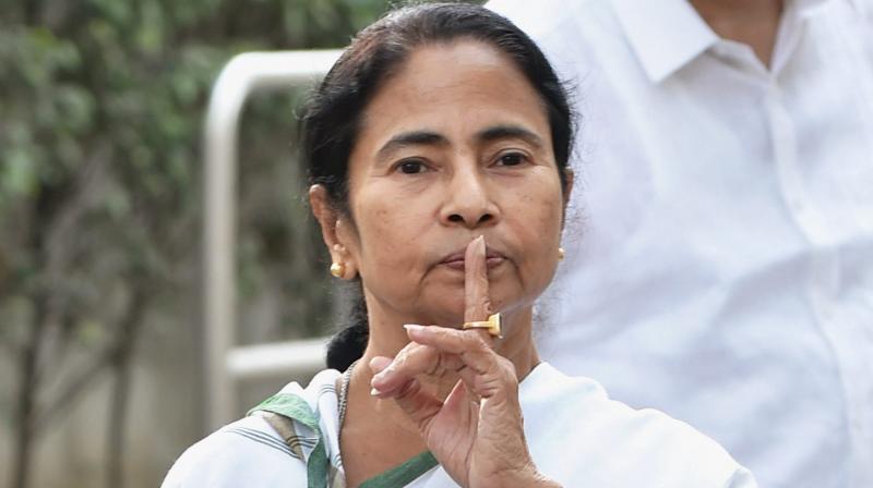 West Bengal Chief Minister Mamata Banerjee gestures at the media after meeting with Congress President Sonia Gandhi at her residence in New Delhi. (Photo: PTI)