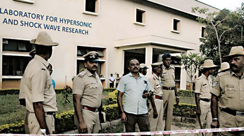 The Indian Institute of Science at Sadashivanagar in Bengaluru on Wednesday.  (Right) Body of the victim 	 KPN