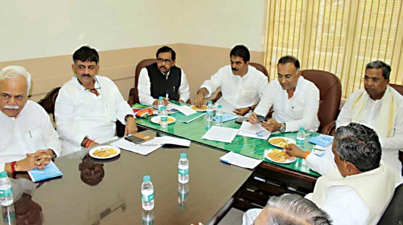 Congress leaders Siddaramaiah, Dr G. Parameshwar, D.K. Shivakumar,  R.V. Deshpande, Dinesh Gundurao and K.C. Venugopal at  a meeting in the city on Wednesday