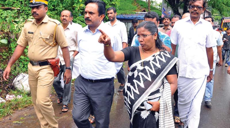 Kozhikode district collector U.V. Jose being briefed by Tehsildar E Anitha Kumari about the survey and encroachment details at Kallayi River area on Friday. (Photo: DC)