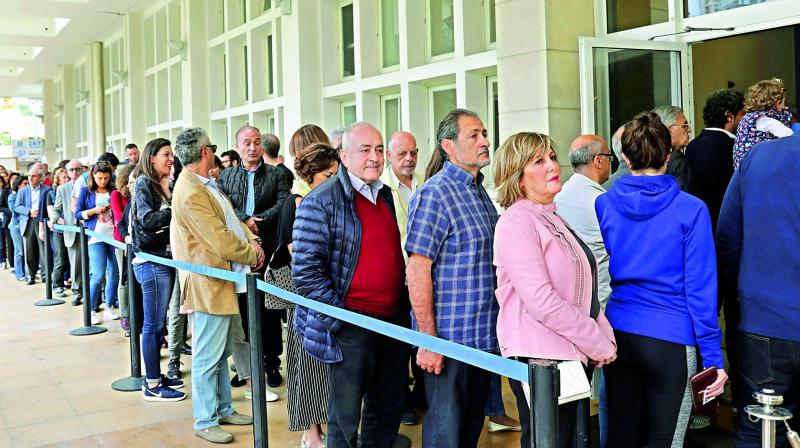 French nationals residing in Lebanon wait to cast their vote at the French embassy in Beirut.
