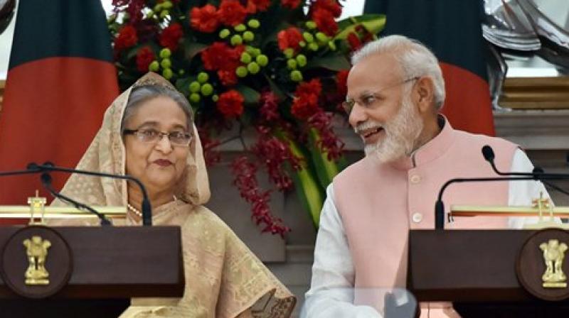 Prime Minister Narendra Modi interacting with his Bangladeshi counterpart Sheikh Hasina during a joint press conference, at Hyderabad house in New Delhi on Saturday. (Photo: PTI)