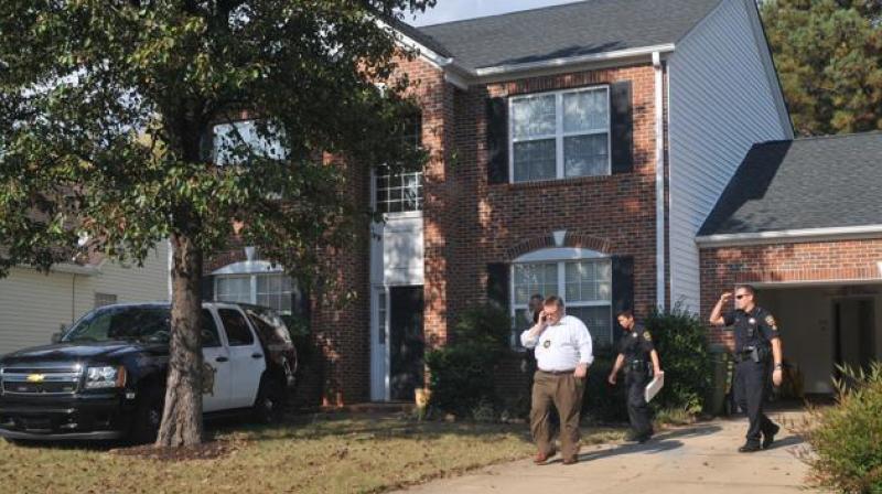 In this Nov 3 photo, registered sex offender Todd Christopher Kohlhepps home is searched by Spartanburg County Sheriffs deputies and his vehicles are impounded in Moore. (Photo: AP)