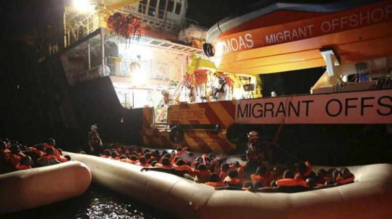 Migrants on dinghy boats are rescued by the vessel Responder, run by the Malta-based NGO Migrant Offshore Aid Station (MOAS) and the Italian Red Cross, in the Mediterranean sea. (Photo: AP)