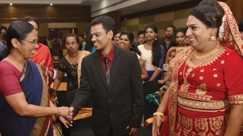 Health minister K.K. Shylaja greets the first transgender persons in the state to tie the nuptial knot, Surya and Ishaan K. Shaan, at the reception organised by the state government at a hotel at Thampanoor in Thiruvananthapuram on Wednesday. (Photo: A.V. MUZAFAR)