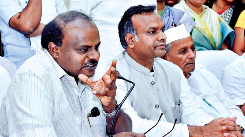 A file photo of Social Welfare Minister Priyank Kharge with Chief Minister H.D. Kumaraswamy in Kalaburagi.