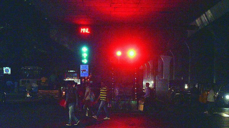 Decorative lights put up alongside of traffic signal light confuses people at Somajiguda. (Photo: DC)