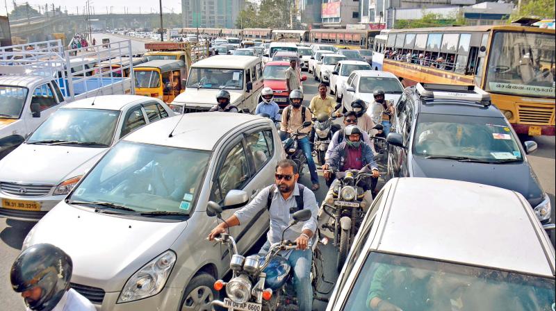 The snarls on Mount Road, Saidapet due to opposition parties protest against bus fare hike, on Monday. (Photo: DC)