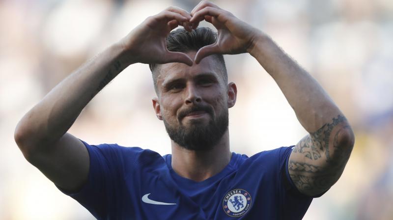 Giroud celebrated his fifth Chelsea goal since his January move from Arsenal by sprinting over to the bench and clambered up to hug team-mate David Luiz, who wasnt involved in the matchday squad. (Photo: AP)