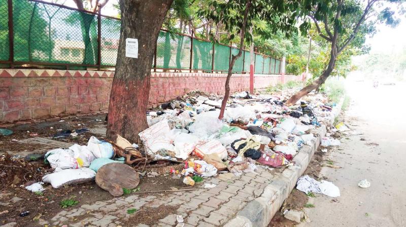 A footpath near Ejipura that has turned into an illegal garbage dump 	DC