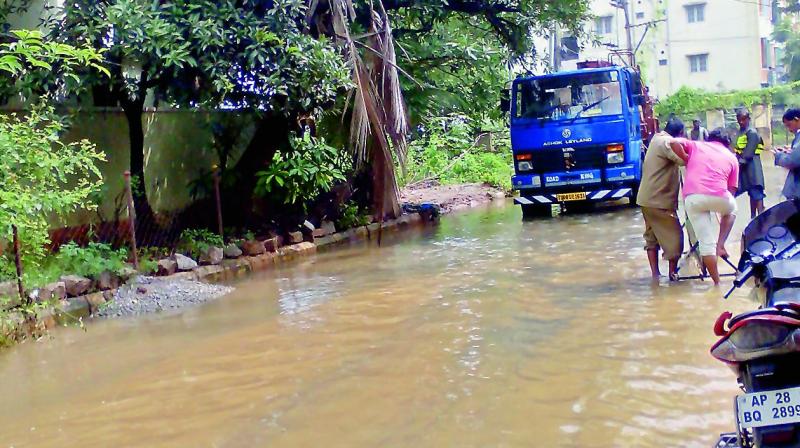 Drain water overflowed at Kapra leaving the colony inundated on Sunday.  (Photo: DC)