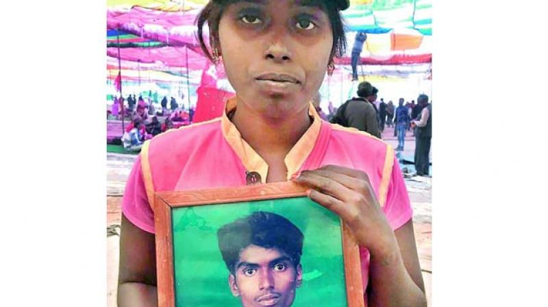 Shobha with the photograph of her late husband.