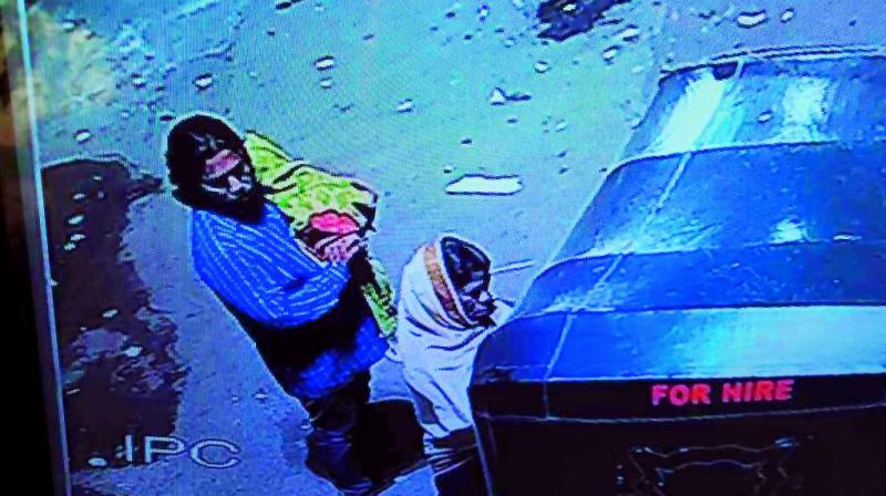 This image grab from a CCTV footage shows Ghouse, the suspect, leaving with the baby he abducted from a homeless couple on Friday.