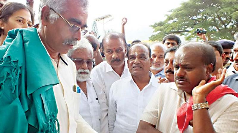 Chief Minister H.D. Kumaraswamy listens to the grievances of a farmer in Chamarajanagar on Friday (Photo:  KPN)