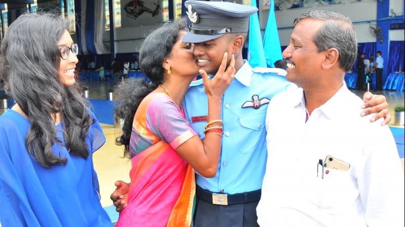 Flying Officer K. Koushik with parents K. Lakshminara-yana, Saroja at the passing out parade at the Air Force Academy, Dundigal.