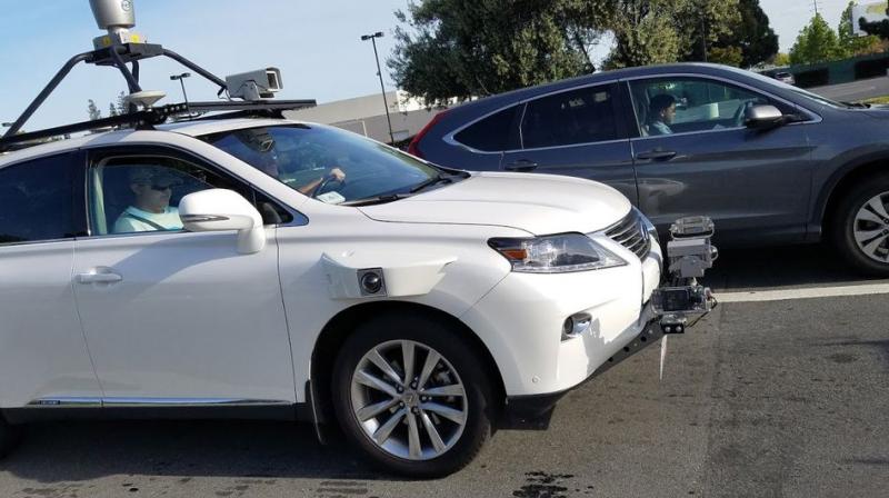 A DMV spokesperson said the company had registered three 2015 Lexus RX450h SUVs to be driven by six Apple employees with expertise in autonomous vehicles. (Photo: Bloomberg)