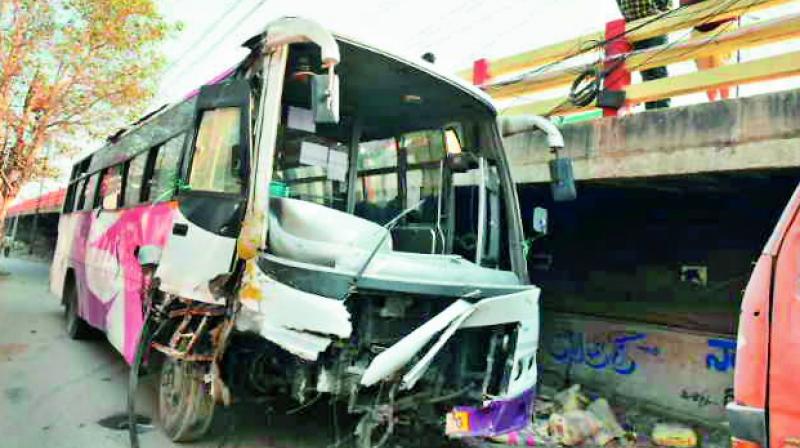 The shatterred bus after it fell off the bridge at Sanathnagar on Wednesday.              DC