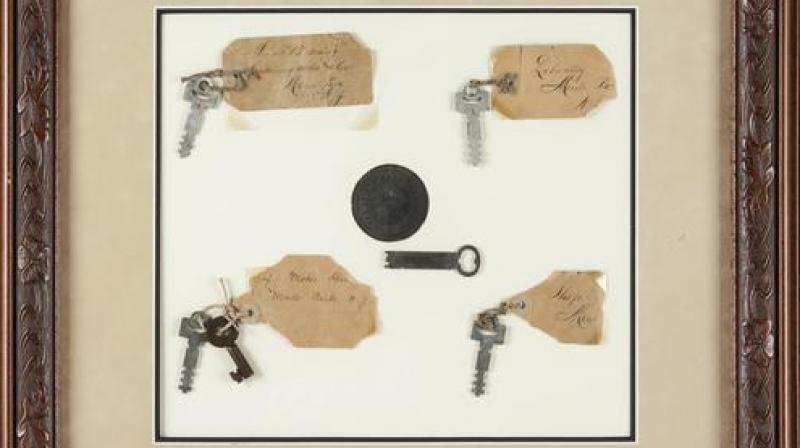 This photo provided by Heritage Auctions shows Thomas A. Edison: Keys to His Menlo Park Laboratory on display. Six keys in all from the famous inventors Menlo Park home and work place will be auctioned Saturday, Dec. 3, 2016 in Dallas, along with five lightbulbs, including two that he created. Heritage Auctions will open the bidding on the two lots. (Heritage Auctions via AP)