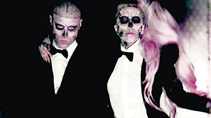Genest, who was famous for his head-to-toe tattoos, starred in the music video for Gagas 2011 smash hit, Born This Way.