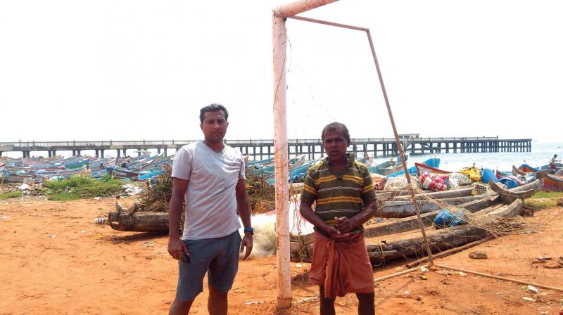 Shyam Simon, a regular who plays on Valiathura football ground, with Christopher V, say that the football net had to be shifted, after the sea ate up the coast