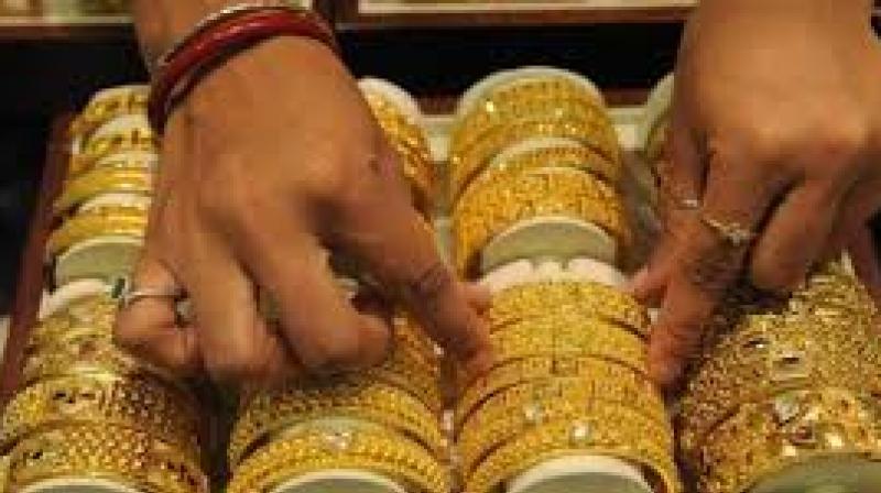 Gold futures fall by Rs 46 on weak global cues