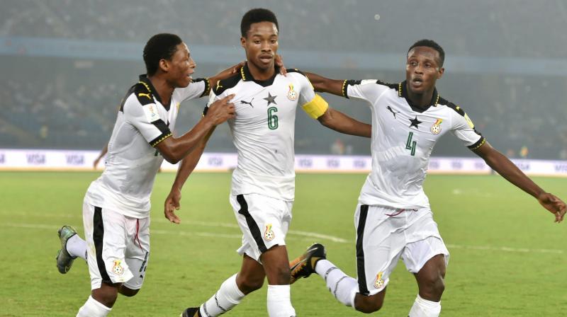 Ghanas Eric Ayiah (Jersey no 6) celebrates with teammates after scoring a goal against India on Thursday. (Photo: PTI)