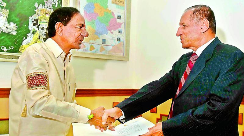 Chief Minister K. Chandrasekhar Rao presents the resolution of the council of ministers recommending the dissolution of the Telangana Legislative Assembly to Governor E.S.L. Narasimhan on Thursday.  (Photo: DC)