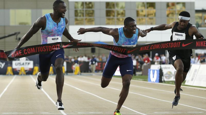 Justin Gatlin, left, reacts as he defeats Christian Coleman, center, in the mens 100-meter final at the US Track and Field Championships. (Photo: AP)