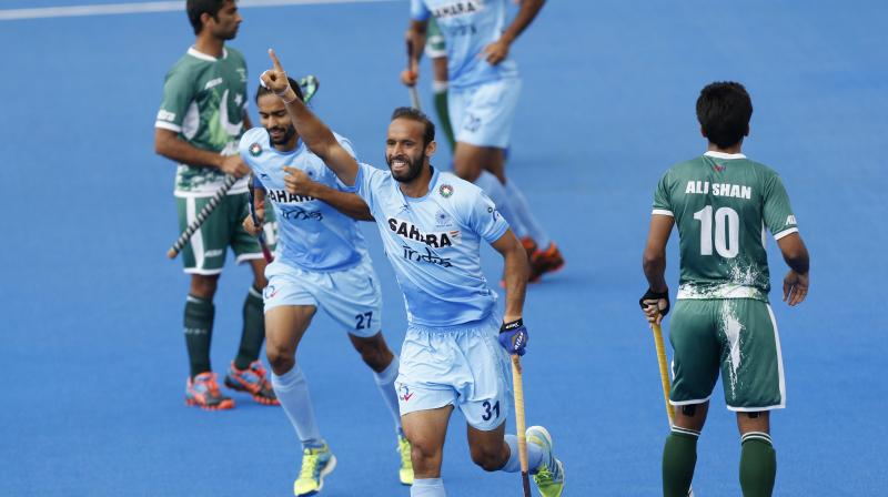 Indias Ramandeep Singh celebrates scoring against Pakistan during the Mens World Hockey League match. (Photo:AP)