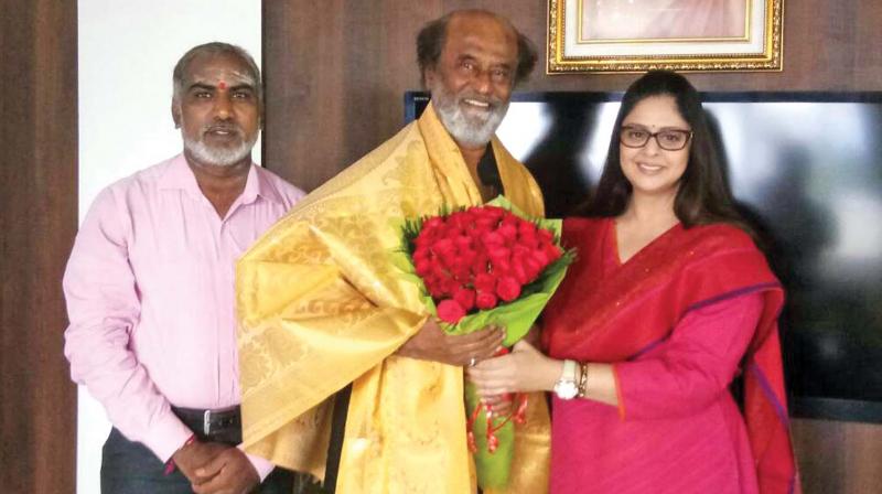 Actor and Mahila Congress chief Nagma meets actor Rajinikanth at his residence in Poes Garden on Sunday. (Photo: DC)