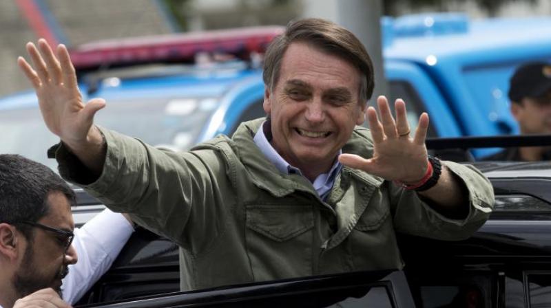 Jair Bolsonaro, waves after voting in the presidential runoff election in Rio de Janeiro in Brazil on Sunday, October 28, 2018. (Photo: AP)