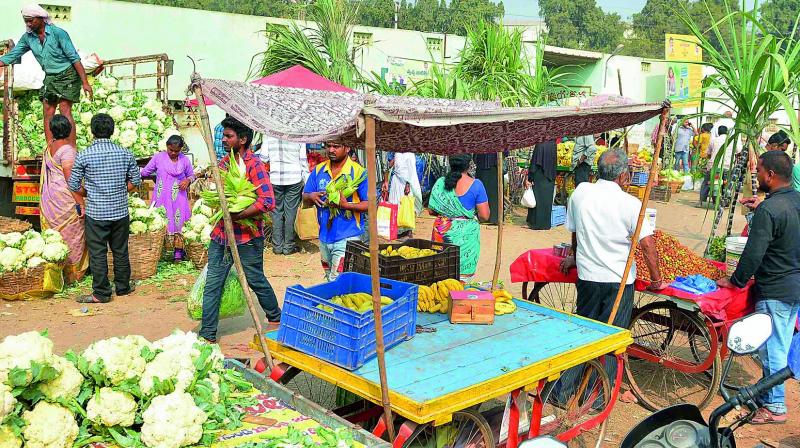 Hawkers outside the Swaraj Maidan Rythu Bazaar in Vijayawada on Saturday. (Photo: DC)