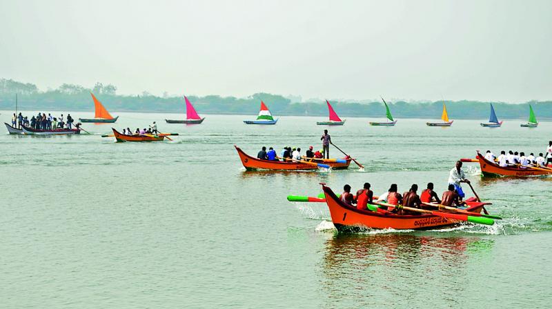 Boat race being held at Nagayalanka on the occasion of Sankranthi in Krishna district on Saturday. (Photo: DC)