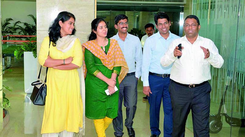 Founder of Sri City Ravindra Sannareddy, explaining salient features of their unit to assistant collectors who were on a study tour on Saturday. (Photo: DC)