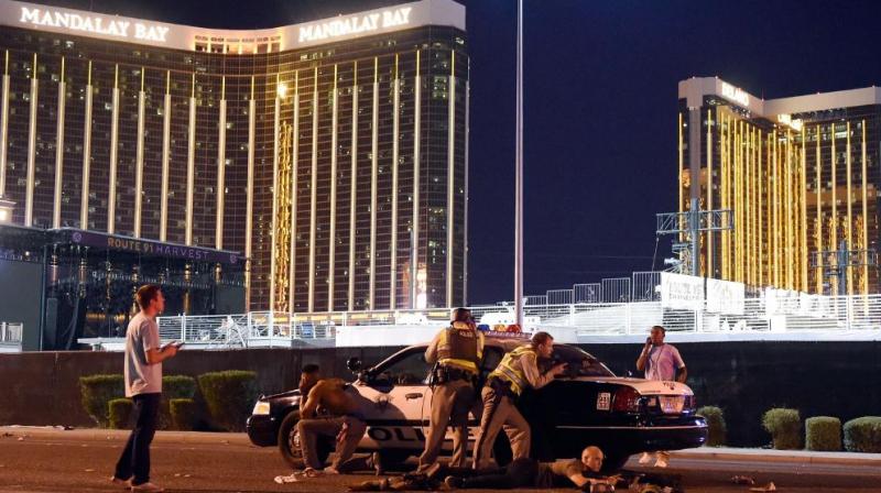 At least two people died early on Monday and 26 were hospitalised with suspected gunshot wounds after a shooting at a music festival on the Las Vegas Strip.