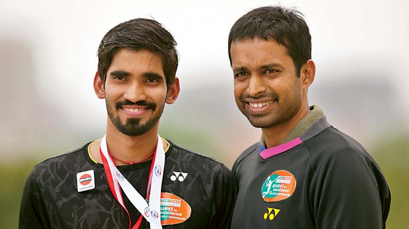 National badminton coach Pullela Gopichand with his ward Srikanth Kidambi (left) in this file photo shot at the Pullela Gopichand Badminton Academy in Hyderabad.