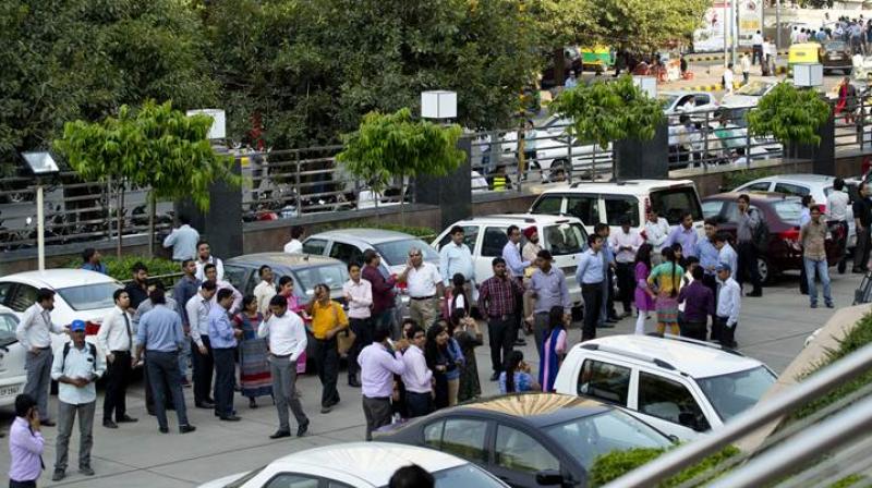 People rushed out of their houses and offices after an earthquake in Delhi. (Photo: AP/File)