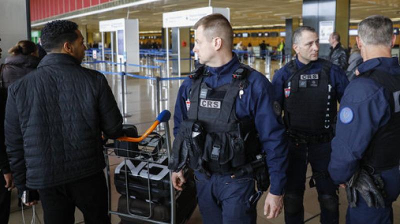 Riot police officers patrol inside Orly airport, south of Paris, as flights began to resume. (Photo: AP)