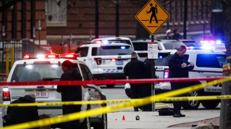 Crime scene investigators collect evidence from the pavement as police respond to an attack on campus at Ohio State University, in Columbus. (Photo: AP)