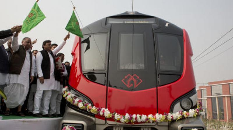 UP CM Akhilesh Yadav and SP supremo Mulayam Singh Yadav, inaugurate a trial run of metro rail service in Lucknow on Thursday. (Photo: AP)