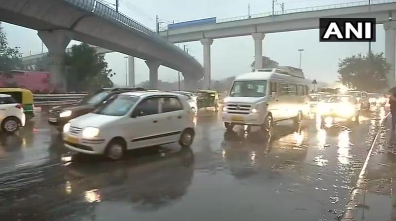 Rains and hailstorms led to traffic congestion in several places across Delhi and visibility was low because of the darkened skies. (Photo: Twitter | ANI)