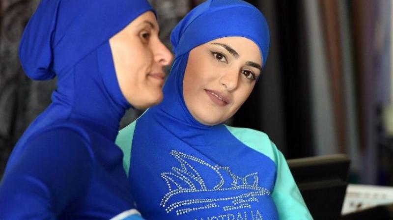 Muslim models display burkini swimsuits in Sydney where burkinis are generally accepted as a means of covering up on the beach. (Photo: AFP)