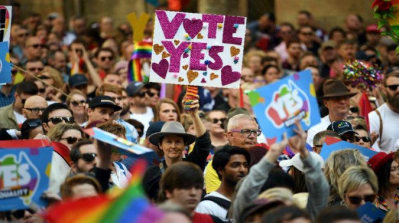 Gay couples who have already married overseas will have their unions officially recognised from Saturday, when the bill comes into full effect. (Photo: AFP)