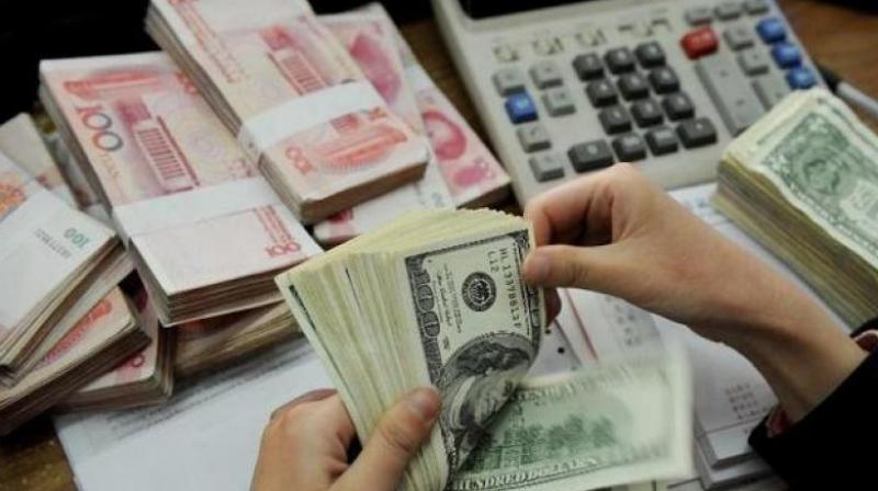 Chinas foreign exchange reserves rose slightly in March as broad U.S. dollar weakness continued.