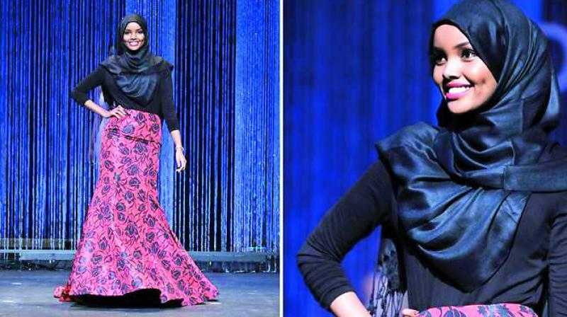 Halima Aden walks the runway like a pro.