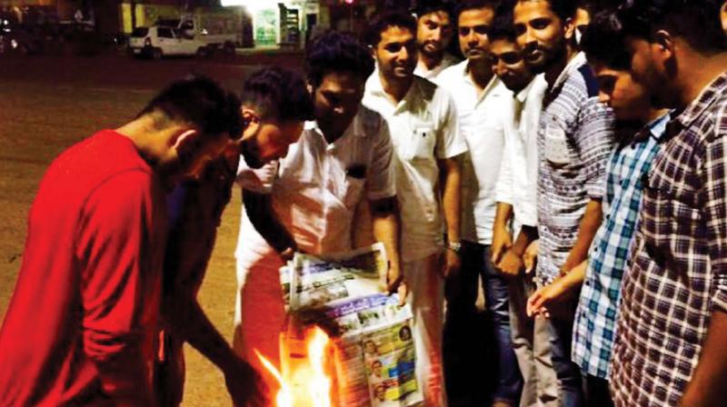 Members of Muslim organisations burn copies of Tulunadu Times in 2016. (Photo: FILE)