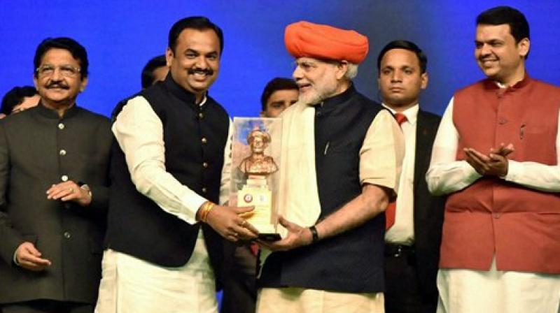 Prime Minister Narendra Modi receiving memento during the foundation stone laying ceremony of the Pune Metro Project (Phase 1), in Pune on Saturday. (Photo: PTI)