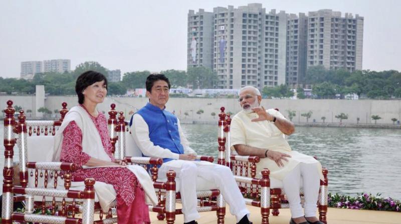 Prime Minister Narendra Modi, Japanese Prime Minister Shinzo Abe and his wife Akie at Sabarmati Ashram in Ahmedabad on Wednesday. (Photo: PTI/File)